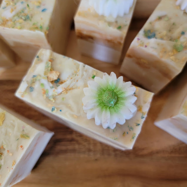 Spiritual Bar Soap-Wildflowers
5oz-141.7grams


Goat Milk M&amp;P Soap Base with rose petal &amp; mica for color. Dried rose and flower pieces added on top. Daisy Soap embed on top. Gold shimmer.


These bars are absolutely beautiful! This chunky size bar is full of self love. Beauty and resilience. Reminding us to see our own goodness in our everyday!


A refreshing fragrance of Wildflowers and champagne! Celebrate you!&nbsp;
A whimsical fragrance with a fun design.





*Soap S