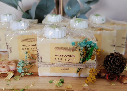 Spiritual Bar Soap-Wildflowers
5oz-141.7grams


Goat Milk M&amp;P Soap Base with rose petal &amp; mica for color. Dried rose and flower pieces added on top. Daisy Soap embed on top. Gold shimmer.


These bars are absolutely beautiful! This chunky size bar is full of self love. Beauty and resilience. Reminding us to see our own goodness in our everyday!


A refreshing fragrance of Wildflowers and champagne! Celebrate you!&nbsp;
A whimsical fragrance with a fun design.





*Soap S