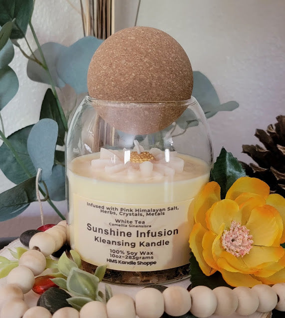 Sunshine Infusion Kleansing Kandle ~ Spiritual

10oz Glass Jar with Ball Cork Lid

100% Soy Wax

Fragrance~White Tea

Kleansing Intention kandles are made of 100% soy wax with a clean and refreshing, light-sweet floral fragrance. This kandle is infused with salts, herbs, crystals and metals.

The dried herbs, salt, crystals and coins are uniquely placed in the bottom of the jar set in a clear bubbly gel wax. The cotton wick is intentionally placed on top of the gel wax so that all of the natural elements ar