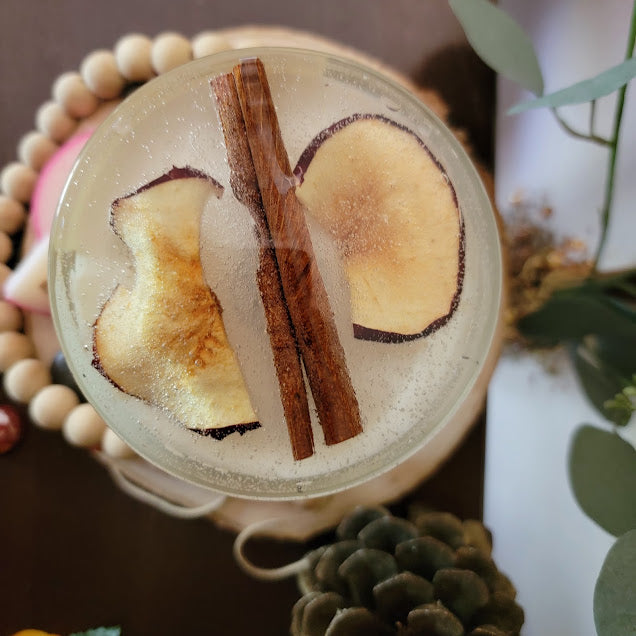 Rustik Apple Kandle-Spiritual

10oz Glass Jar with Ball Cork Lid

10oz~283grams 100% Soy Wax

Apple-Cinnamon&nbsp;

Infused with Dried Apple Slices&nbsp;&amp; Whole Cinnamon Sticks. This blend brings in self love, prosperity, protection. Assists in feeling safe, warm and cozy. Also a fun apple wax melt on top with a sprinkle of cinnamon.

The dried herbs are uniquely placed in the bottom of the jar set in a clear bubbly gel wax. The cotton wick is intentionally placed on top of the gel wax so that all of t