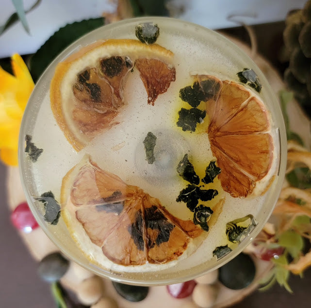 Squeezed Kandle-Spiritual

10oz Glass Jar with Ball Cork Lid

10oz~283grams 100% Soy Wax

Fresh Lemons

Infused with Mulberry Leaves &amp; Dried Lemons. Brings in Sun Energy with clean, fresh high vibrational energy. Protection, grounding &amp; strength &amp; abundance. A fun lemon wedge on top of kandle.

The dried herbs are uniquely placed in the bottom of the jar set in a clear bubbly gel wax. The cotton wick is intentionally placed on top of the gel wax so that all of the natural elements are kept below