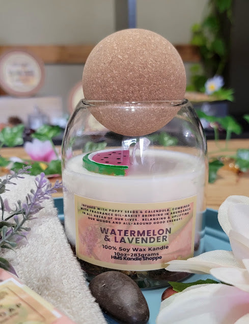 Watermelon-Lavender Kandle-Spiritual

10oz Glass Jar with Ball Cork Lid

10oz~283grams 100% Soy Wax

Fresh Watermelon with a hint of lavender.

Infused with Poppy Seeds &amp; Calendula. Combined with fragrance oil-assist bringing in abundance in all areas of our lives. relaxing &amp; Uplifting our moods and all-around good energy! Also, a fun wax melt watermelon on top.

The dried herbs are uniquely placed in the bottom of the jar set in a clear bubbly gel wax. The cotton wick is intentionally placed on top