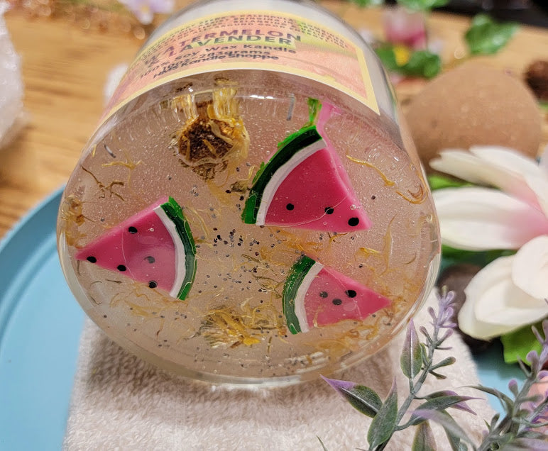 Watermelon-Lavender Kandle-Spiritual

10oz Glass Jar with Ball Cork Lid

10oz~283grams 100% Soy Wax

Fresh Watermelon with a hint of lavender.

Infused with Poppy Seeds &amp; Calendula. Combined with fragrance oil-assist bringing in abundance in all areas of our lives. relaxing &amp; Uplifting our moods and all-around good energy! Also, a fun wax melt watermelon on top.

The dried herbs are uniquely placed in the bottom of the jar set in a clear bubbly gel wax. The cotton wick is intentionally placed on top