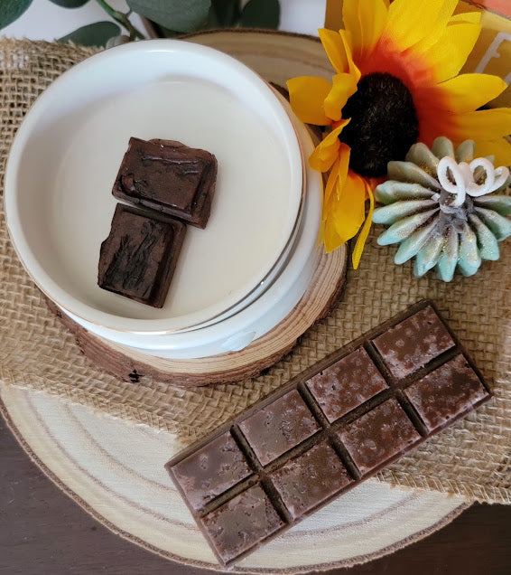 Chocolate Crunch Bar Wax Melts

3oz~85grams

100% Soy Wax Snap Bar

Chocolate fudge &amp; Salted Honey Butter Fragrance&nbsp;

Infused with Chocolate and Salted Honey Butter fragrance. Assist with, Heart Opening, Joy and Elevation, Grounding, Sweetness and Flow, Nourishment and Abundance.&nbsp;

These bars make great gifts for chocolate lovers!&nbsp;

Use and Warnings..

Snap a square off and place melt in Wax Warmer, Medium-High heat setting. Do not leave warmer unattended. Do not leave warmer on for more 