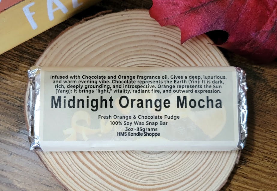 Midnight Orange Mocha Bar Wax Melts

3oz~85grams

100% Soy Wax Snap Bar

Fresh Orange &amp; Chocolate Fudge Fragrance&nbsp;

Infused with Chocolate and Orange fragrance oil. Gives a deep, luxurious, and warm evening vibe. Chocolate represents the Earth (Yin): It is dark, rich, deeply grounding, and introspective. Orange represents the Sun (Yang): It brings "light," vitality, radiant fire, and outward expression.

These bars make great gifts for chocolate lovers!&nbsp;

Use and Warnings..

Snap a square off 
