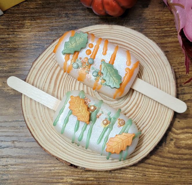 Fall Cake Pops- Wax Melts- spirituals

Package contains 2 cake pops.

3oz-85grams

Orange Pumpkin Buttercream Fragrance

Infused with Pumpkin Spice-Orange fragrance &amp; Salt. Assist in clearing energy, bringing in prosperity, protection &amp; sun energy.

&nbsp;*The cake pop can be cut into smaller pieces if you choose. Cake Pops can be cut with a warm knife. Or you can place entire cake pop in warmer dish. Stick can be removed once wax is melted or left in.. once wax hardens again stick can help to remov