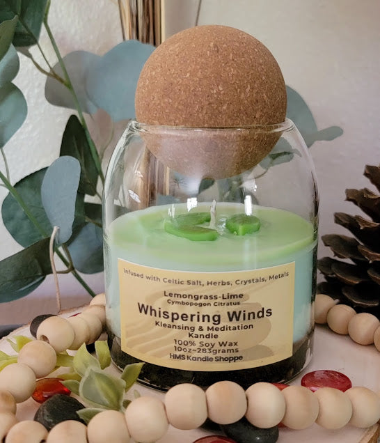 Whispering Winds- Kleansing & Meditation Kandle

10oz Glass Jar with Ball Cork Lid

Fresh Lemongrass &amp; Lime Meditation Whispering Winds Intention kandles are made of 100% soy wax with a fresh, clean lemongrass-lime fragrance. This kandle is a great tool to use during meditation. The combination of herbs, salts, crystals and metals assist in clearing energy and bring you to a calm state of mind.

The dried herbs, salt, crystals and coins are uniquely placed in the bottom of the jar set in a cl